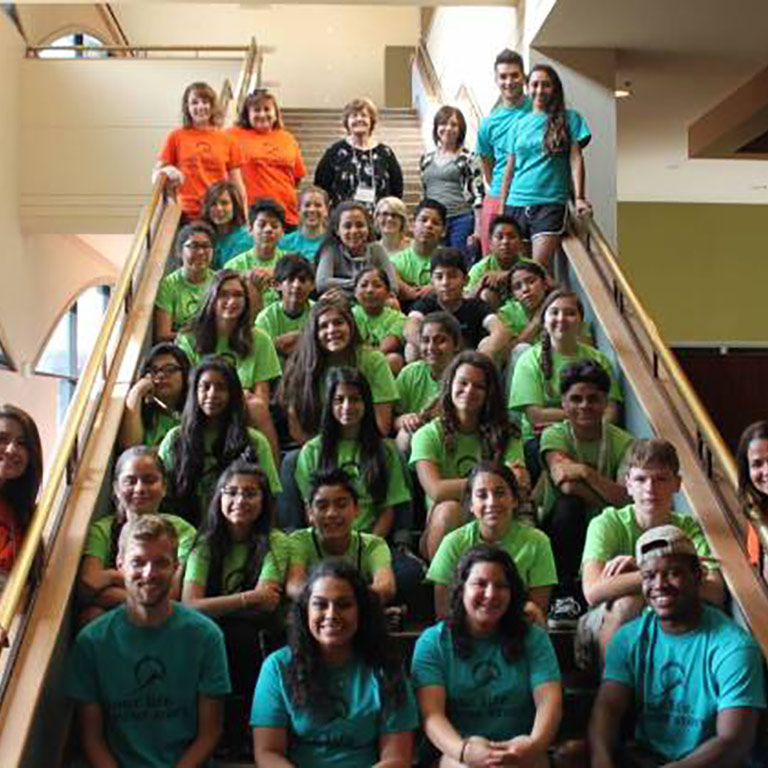 group of students sitting on stairs