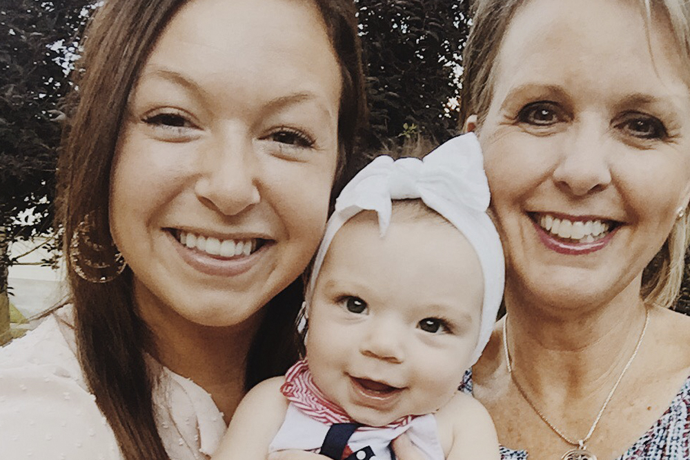 mother-daughter duo Kathleen McAllen and Erin Winders with a baby
