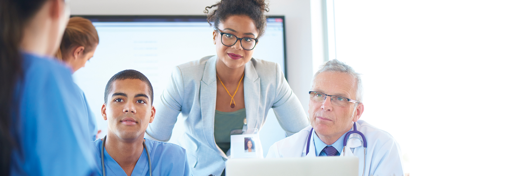 health administrator and two doctors in conversation