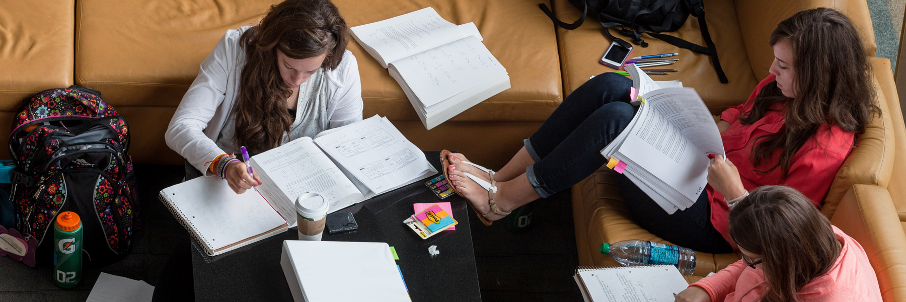 group of students studying on couches in Campus Center