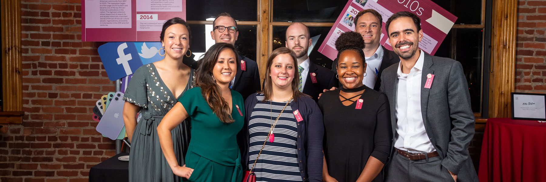 7 fsph alumni and professor gary brumitt smiling for photo
