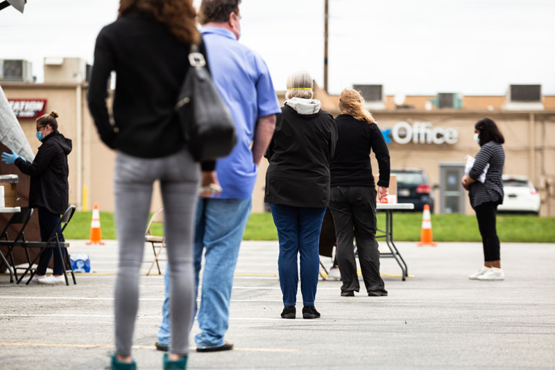 people standing in line to be tested for covid-19