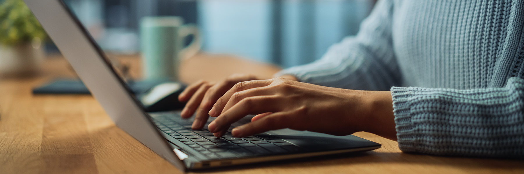 person typing on keyboard