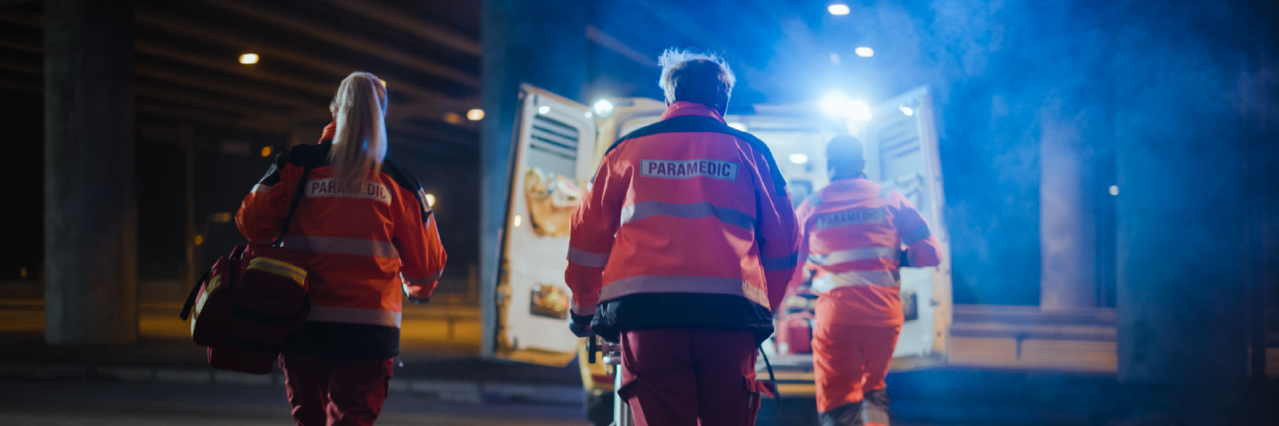 paramedics rushing to ambulance