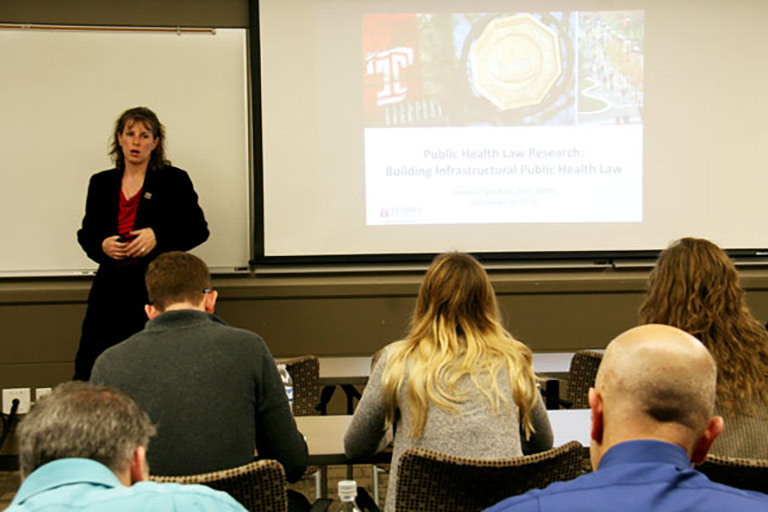 instructor speaks in classroom