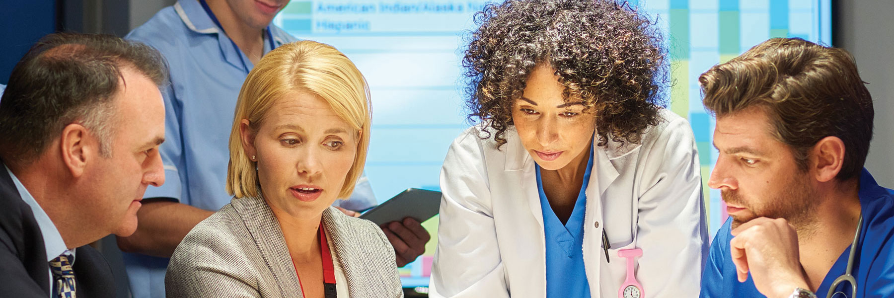 health administrator showing data on computer